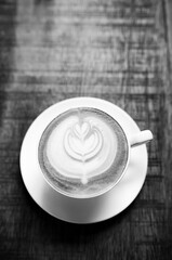 Latte Coffee on a Wooden Table A Warm Morning Moment
