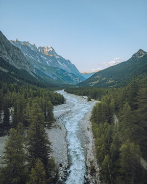 Aerial view of scenic Val Veny with Fiume Dora di Veny and majestic Mont Blanc, La Visaille, Courmayeur, Aosta Valley, Italy.