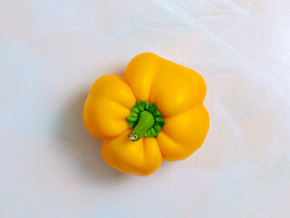 yellow pepper, one, light background, photo from above, vegetarian food