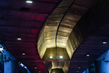 Highway overpass in Jakarta, Indonesia with purple and warm yellow light. As seen from road...
