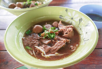 fresh Thai tender beef noodles on table
