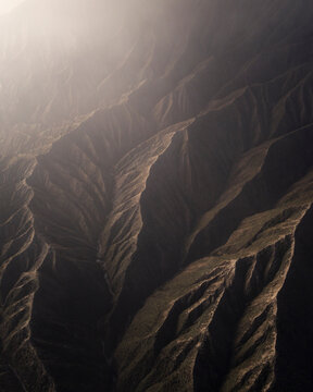 Aerial view of majestic mountain range with rugged peaks and serene valleys, Tosari, Pasuruan, East Java, Indonesia.