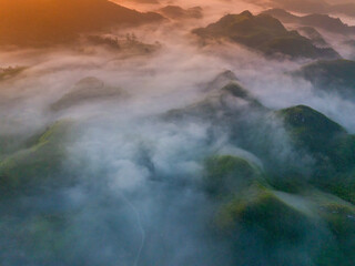 Orange sky and sea of clouds before sunrise. A peaceful, refreshing feeling. View of the hills surrounding Ba Quang, Ha Lang district, Cao Bang province, Vietnam