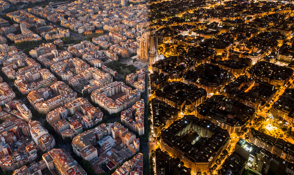 Aerial view of illuminated Basilica de la Sagrada Familia amidst a beautiful cityscape at twilight, Barcelona, Spain.