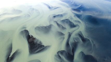 Aerial view of beautiful and pristine river patterns in serene highlands landscape, Iceland.