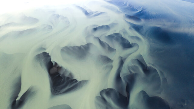 Aerial view of beautiful and pristine river patterns in serene highlands landscape, Iceland.