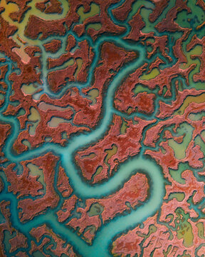 Aerial view of beautiful marshes with serpentine river patterns, Essex, United Kingdom.