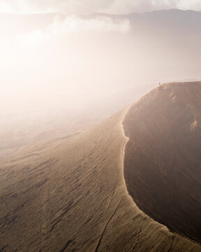 Aerial view of majestic Mount Bromo with its dramatic crater and clouds, East Java, Indonesia.