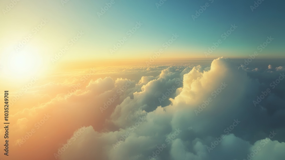 Poster The warm light of the setting sun illuminates a thick layer of fluffy clouds from above, creating a captivating view for passengers on an airplane