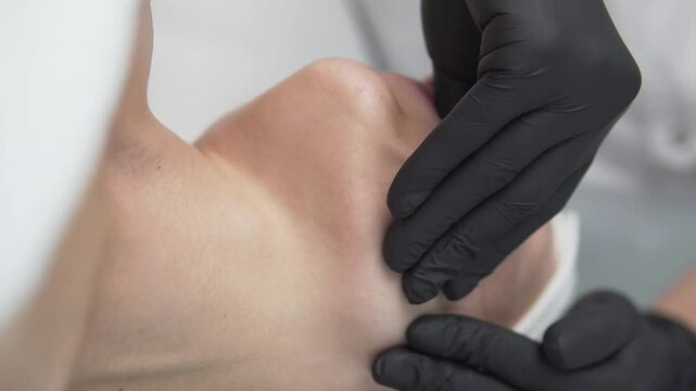 Buccal facial massage to tighten the facial muscles and highlight the cheekbones