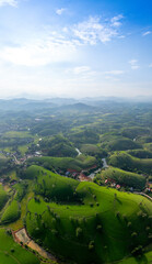 Fototapeta premium Aerial view of Long Coc tea hills, Phu Tho province, Vietnam. Beautiful green tea plantation in Vietnam. Nature background.
