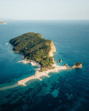 Aerial view of beautiful Sveti Nikola Island with turquoise waters and sandy beaches, Budva Municipality, Montenegro.