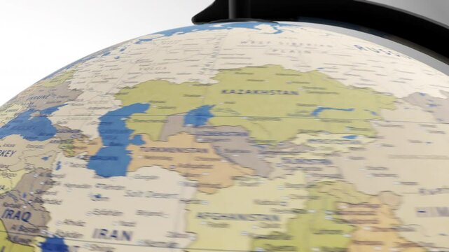Atlas map of the world globe spinning zooming in and focusing on the country of Italy, Italian, Rome, Milan, Naples.