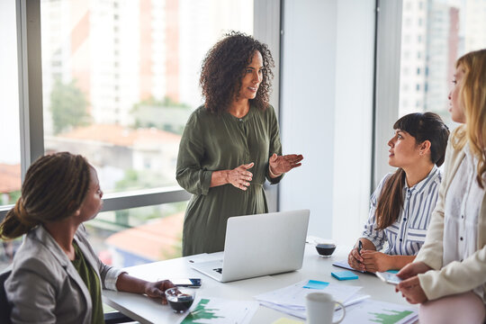 Manager, training and team of business women in meeting, coaching or learning in creative startup. Group, leader and discussion for brainstorming ideas, project update and metrics for event planning