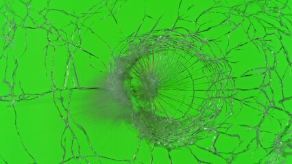 Close-up of gunshot through the glass, shattering against the green background