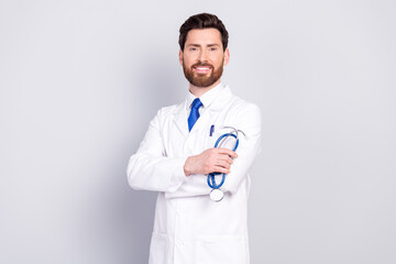 Photo of confident handsome doctor intern wear white coat work in medical center isolated on grey...