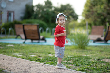 portrait of a child with ice cream in a park