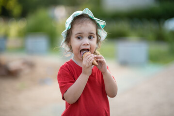 Close-up portrait of a child with ice cream