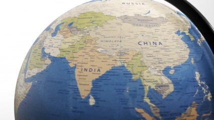 atlas map of the world globe spinning zooming in and focusing on the country of riyadh, saudi arabia, dubai, united arab emirates.