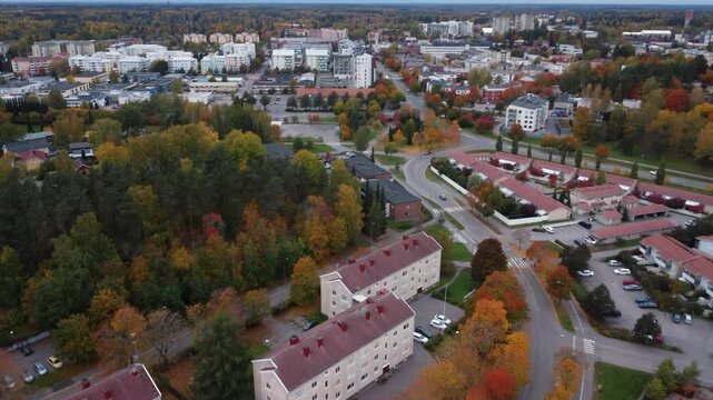 Flyover of Kerava, Finland with trees in vibrant autumn colours