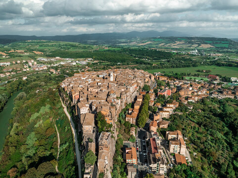 Aerial view of historic medieval town with stone buildings and scenic valley, Orte, Lazio, Italy.