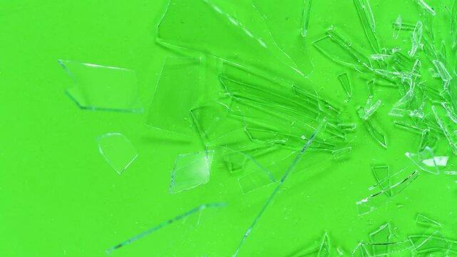Super slow motion of shattering glass against green screen background . Filmed on high speed cinema camera, 1000 fps.
