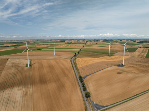 Aerial view of wind turbines amidst green fields and rural landscape, Son, Ardennes, France.
