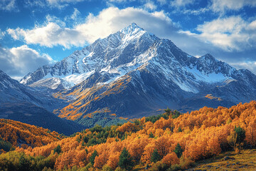 Fototapeta premium Majestic snow-capped mountain surrounded by autumn foliage