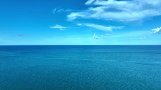 Nature of the beach and sea Summer with sunshine, sandy beaches, clear blue waters sparkling against the blue sky. On an island with good ecology and environment Background for summer vacation concept