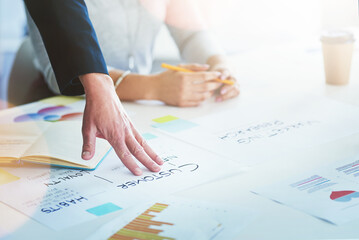 Hands, cooperation and business people in meeting, documents and planning for project. Employees, closeup and design agency with paperwork, ideas or creativity for proposal, teamwork or brainstorming