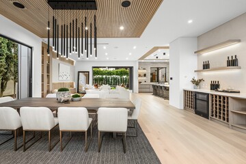 Modern dining and living area with garden view.