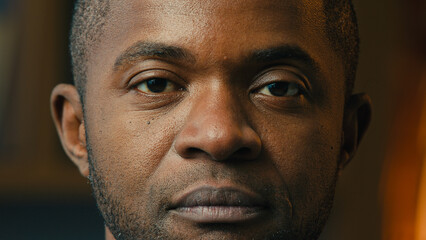 Fototapeta premium Close-up male portrait serious sad lonely mature african american man looking at camera desperate unhappy hopeless middle-aged ethnic businessman posing indoors crisis problem concept moving footage