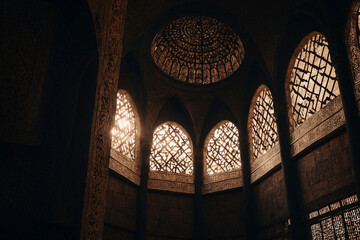 The dome of the mosque is silhouetted in the shadows