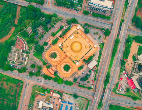 Aerial view of the beautiful Nigeria National Mosque surrounded by bustling roads and vibrant greenery, Abuja, Nigeria.
