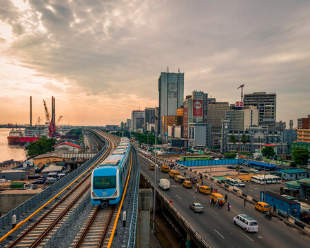 Lagos, Nigeria - 25 May 2024: Aerial view of bustling cityscape with modern buildings and vibrant traffic at sunset, Lagos, Nigeria.