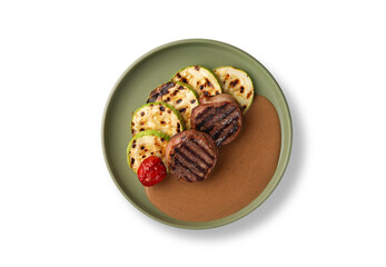 Russian cuisine. Grilled meat with zucchini on white background