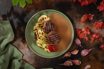 Russian cuisine. Grilled meat with zucchini