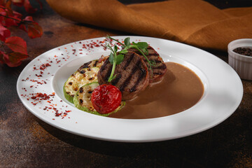 Russian cuisine. Grilled meat with zucchini