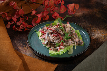 Russian cuisine. Salad with mushrooms, beef and sweet red pepper