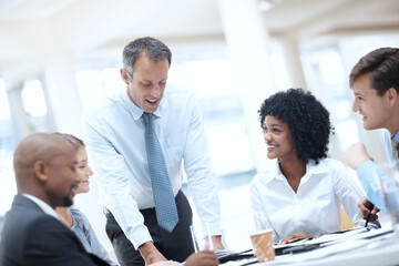 Business people, documents and collaboration with team for meeting, corporate plan or project at office. Businessman, executive or speaker talking to group of employees for improvement or development