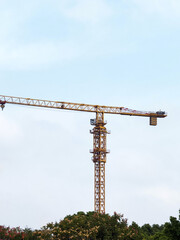 Towering Construction Crane Against a Blue Sky: Engineering Marvel