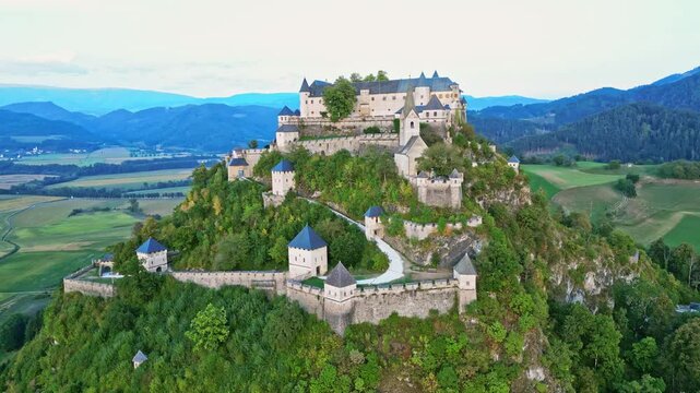 Aerial view of hochosterwitz castle fortress on a hilltop surrounded by scenic landscape and greenery, St. Veit, Austria.
