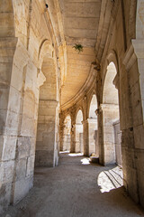 Wander through the ancient stone pathways of the Arles Roman Era Amphitheater, where cave-like passages and carved steps create a mystical journey. Each step echoes with history, inviting exploration
