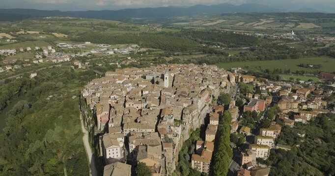 Aerial view of historic medieval town with stone buildings and rooftops, Orte, Italy.