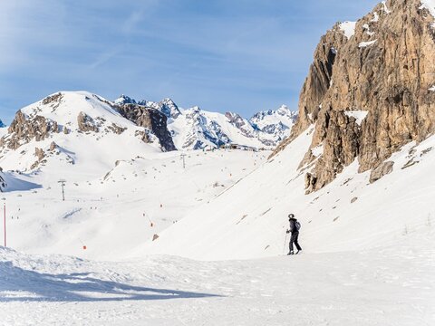 Skier on snowy slopes in Serre Chevalier, French Alps