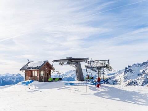 Ski lift station at Serre Chevalier resort in snowy mountains