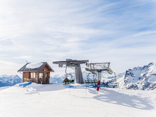 Ski lift station at Serre Chevalier resort in snowy mountains