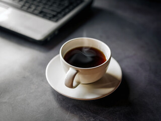 Relax during business work concept, americano coffee cup and black coffee cup aromatic and laptop computer in morning
