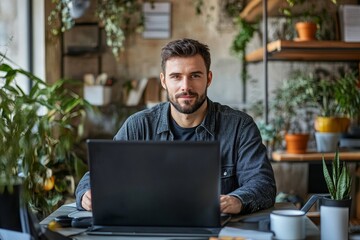 Young man working on computer in modern workplace, Generative AI