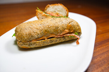 Bread sandwich on a white plate.